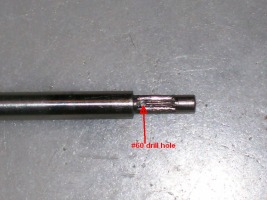 Gear pinion with #60 hole drilled through the shaft.