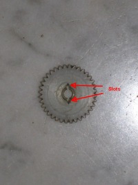 Slots cut into the nylon gear for the clock pinion wire to engage.